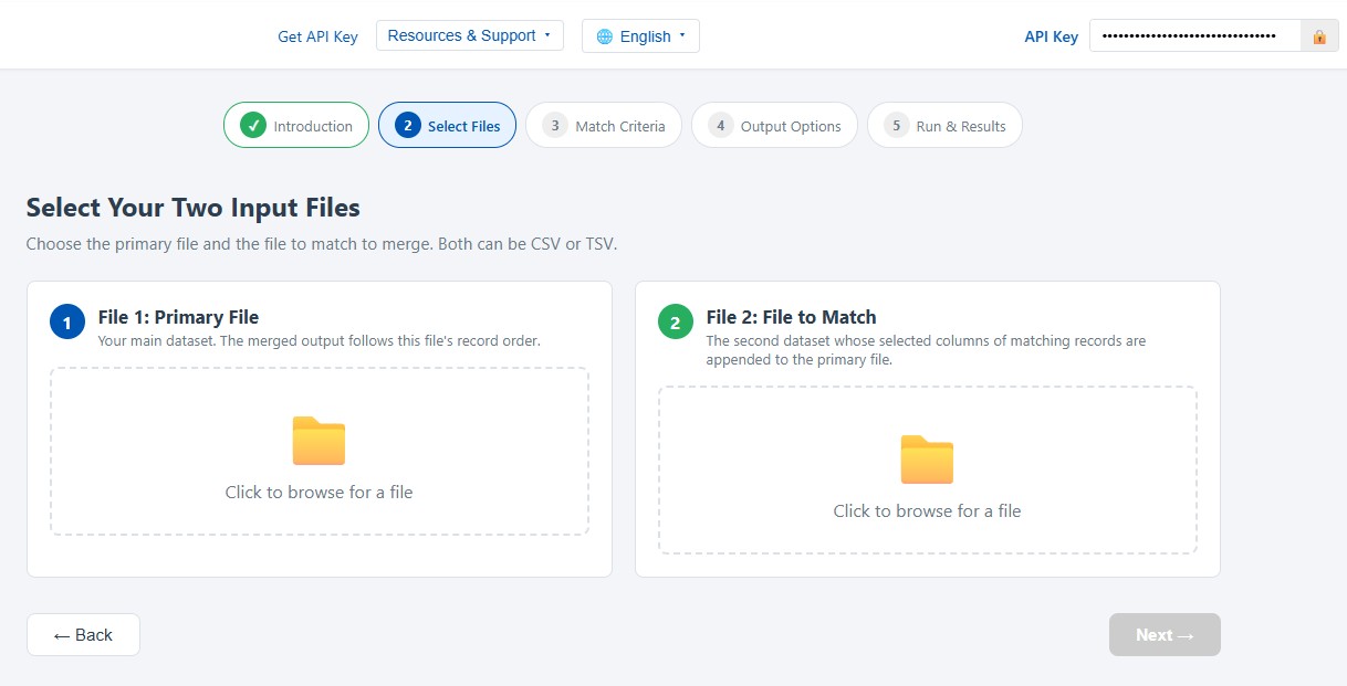 Merge Wizard file selection step showing the Primary File and File to Match upload panels with data previews and highlighted header rows